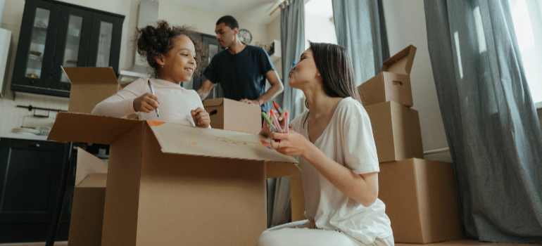 family with a child packing for moving from Nampa to San Jose