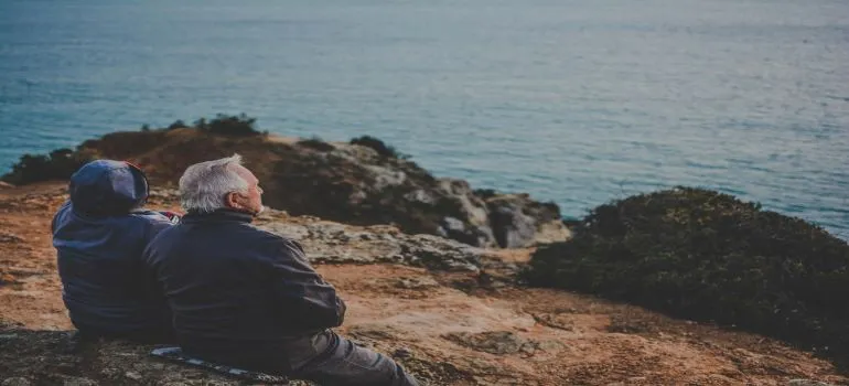 An old couple enjoying next to the river after they followed Idaho retirement guide 