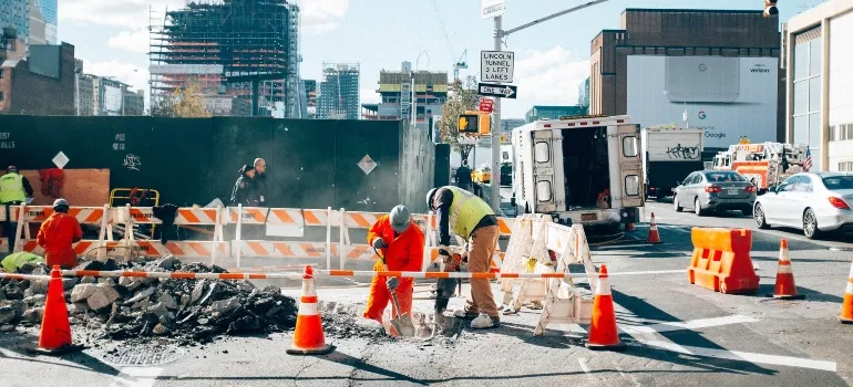 Construction site with people working.