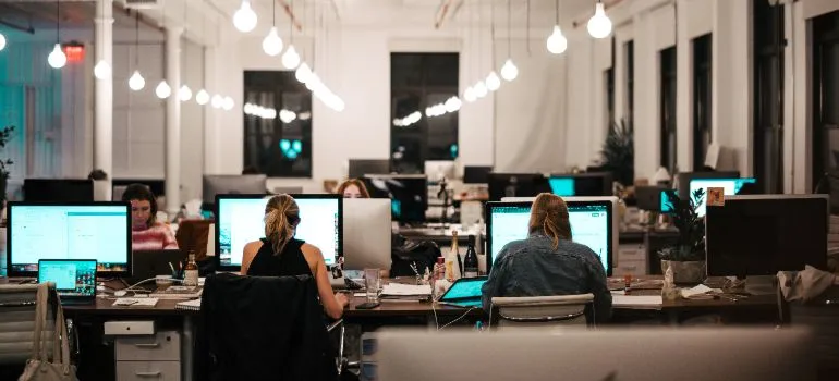 employees at their computers in an office