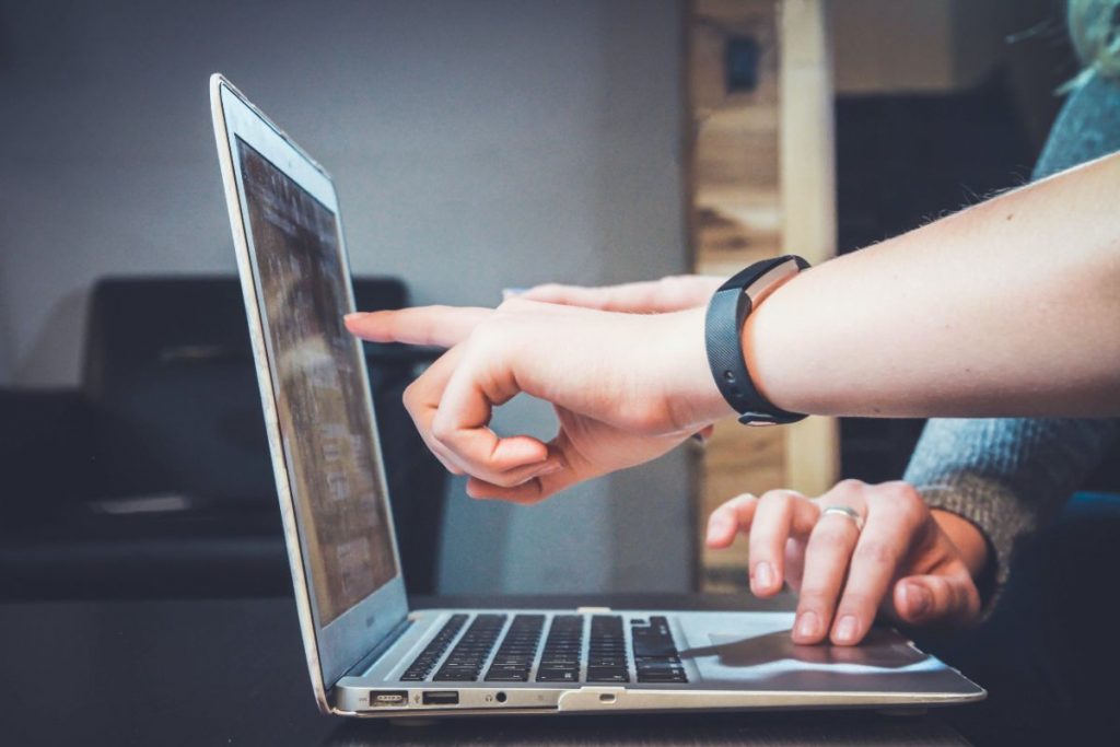 two people trying to search for moving companies