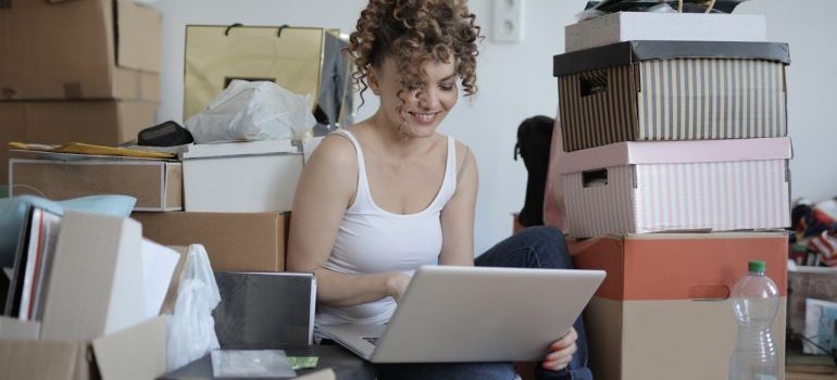 woman looking online how to do spring cleaning with self-storage