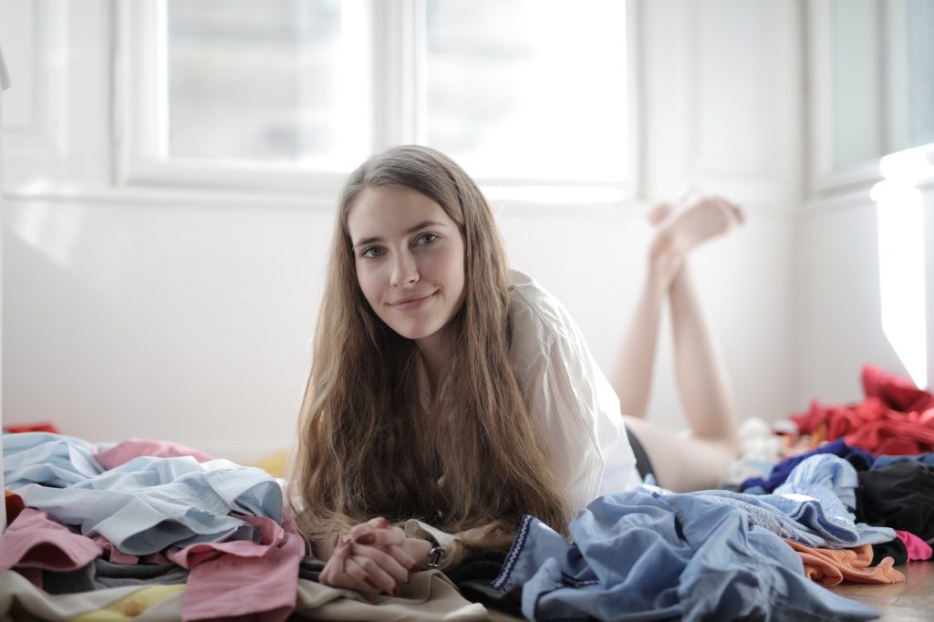 woman with a pile of clothes