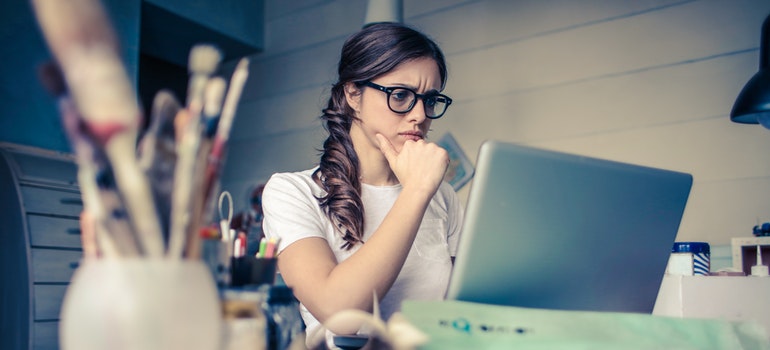 A girl looking at a lap top