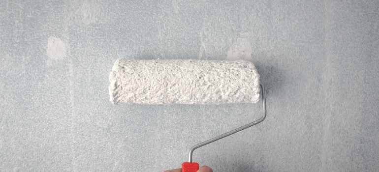 painting a wall before converting your attic into an extra room