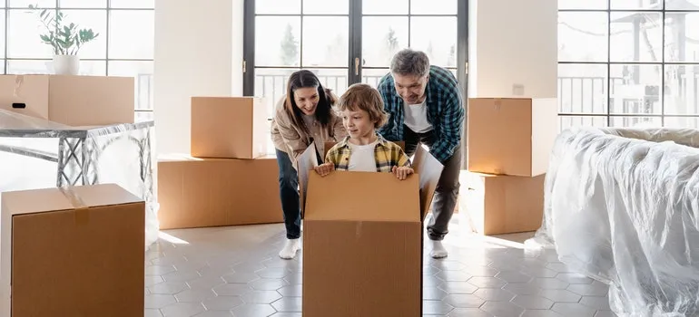 parents with a kid trying out ways to reuse your moving boxes