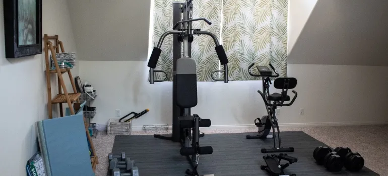 someone storing workout equipment in the attic