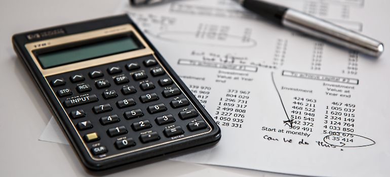 calculator and a budget plan on a table