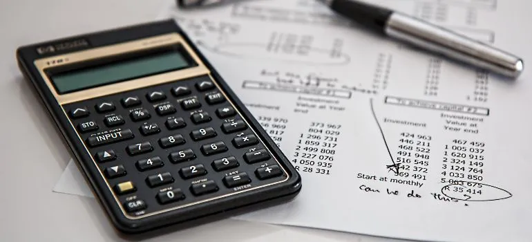 calculator and a budget plan on a table
