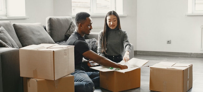 two people packing before moving from Boise to Lewiston