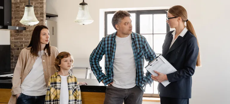 Woman in talking to a family about tips for renting out Boise apartment