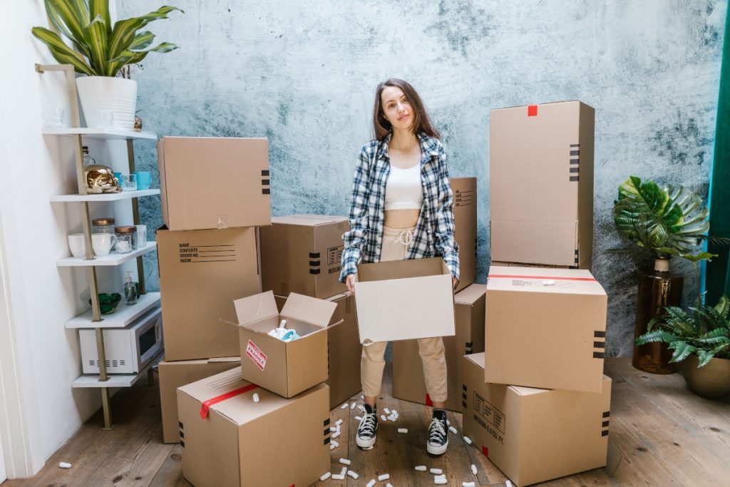 girl surrounded by boxes