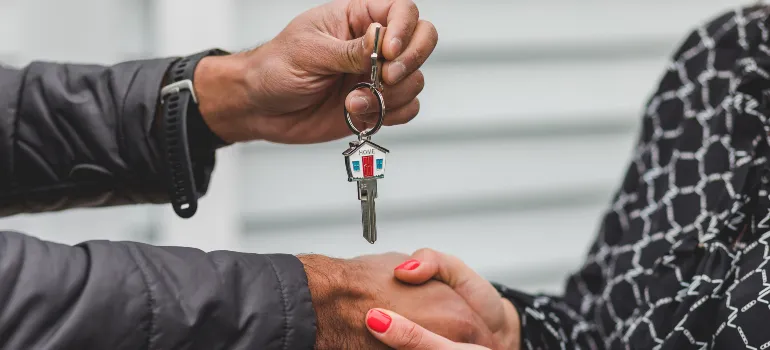 man giving a woman a house key