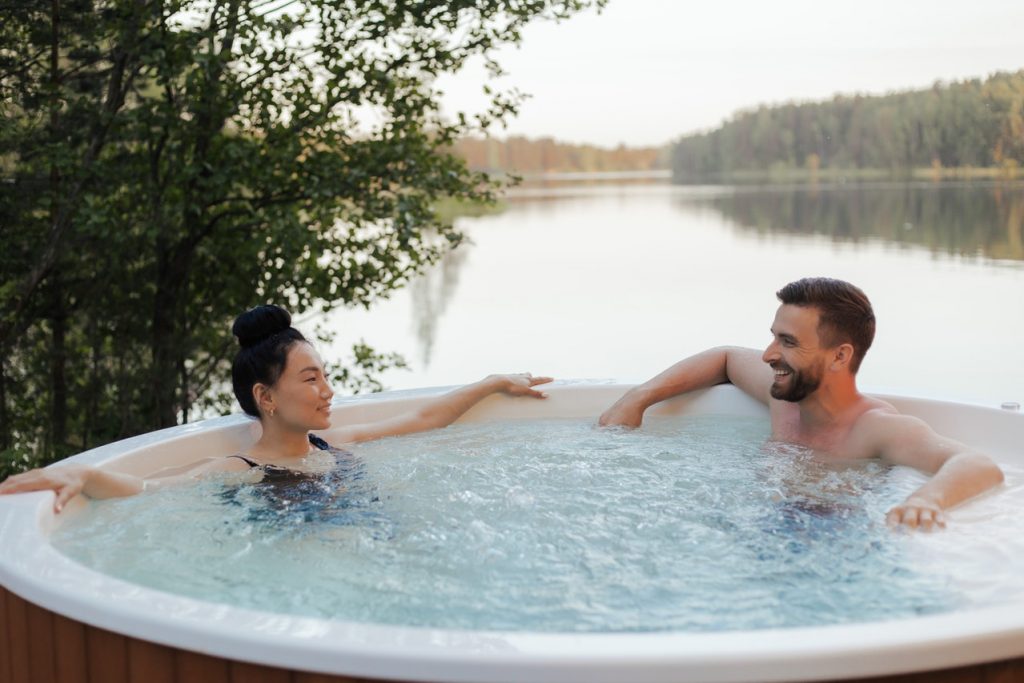 two people in a hot tub before packing and moving a hot tub
