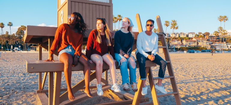four friends sitting on a bench