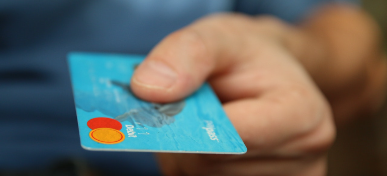 a person holding a credit card