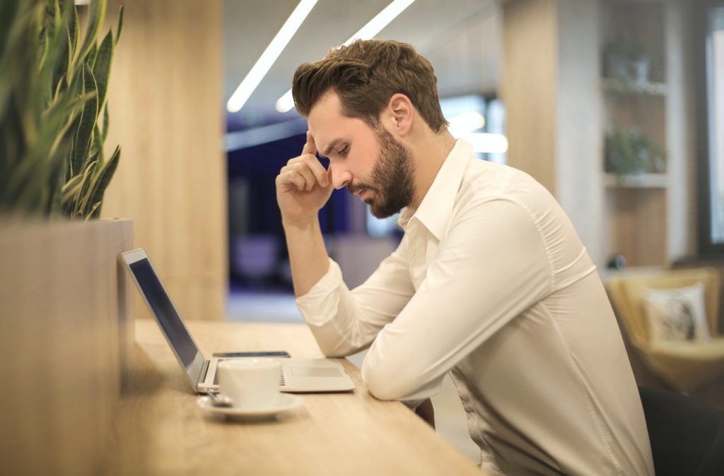 man looking at a computer