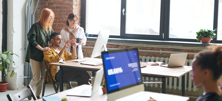 co-workers looking upsides of a minimalist office layout
