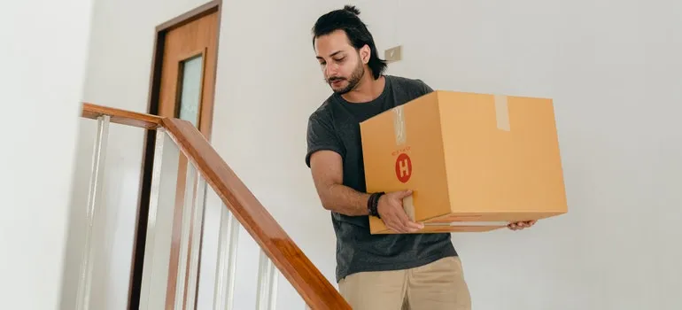 person with an essential box