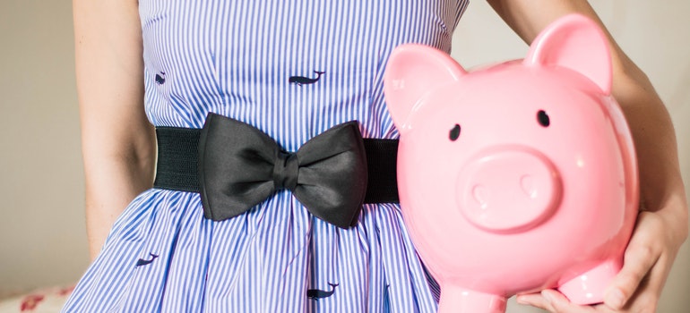 person holding piggy bank