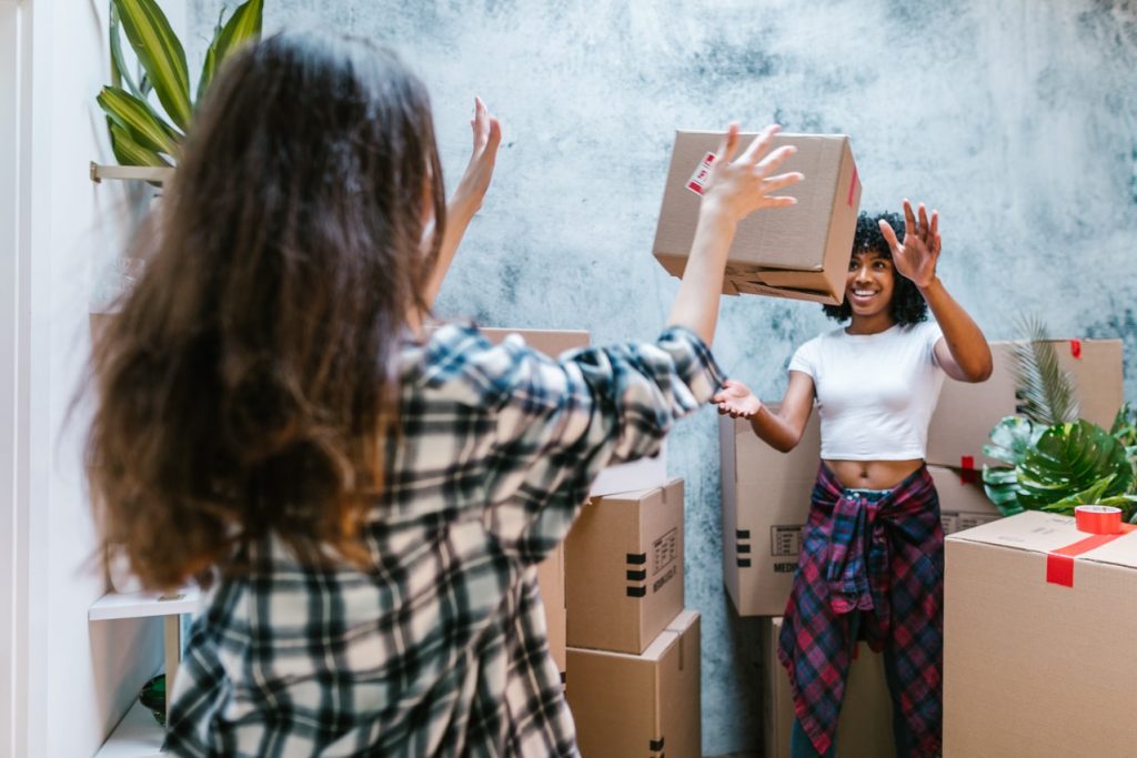 two people with moving box
