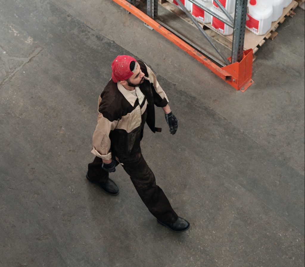 man walking in a storage