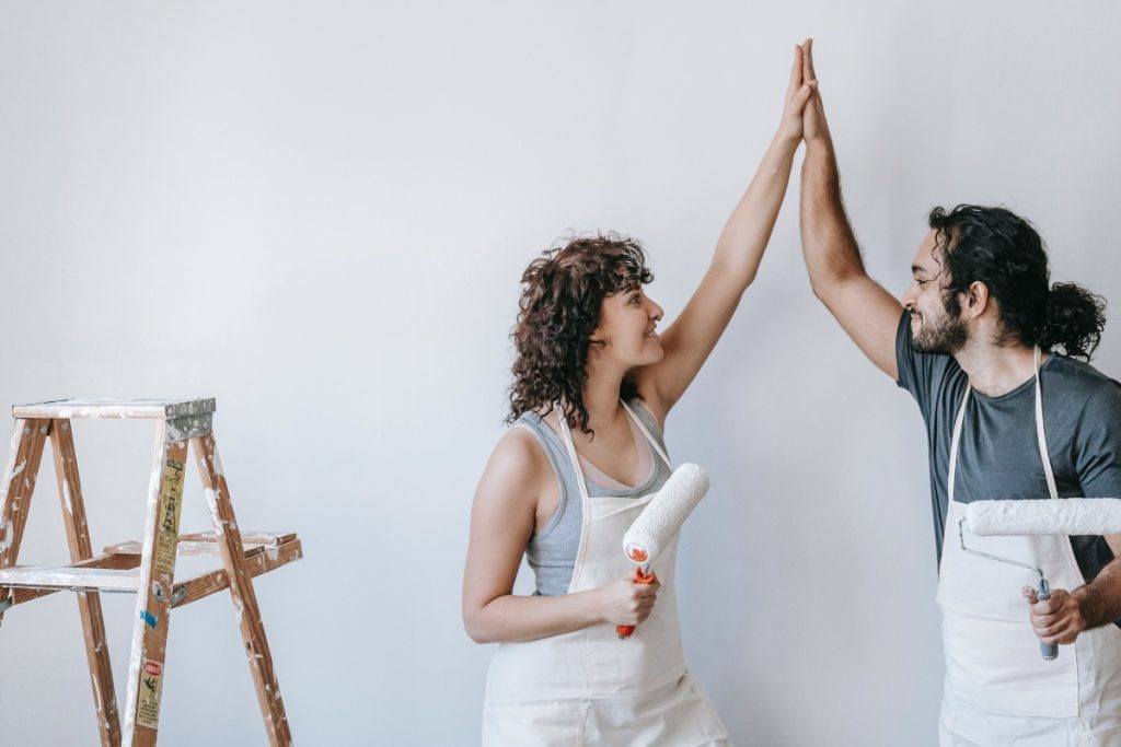 happy couple finished painting their home