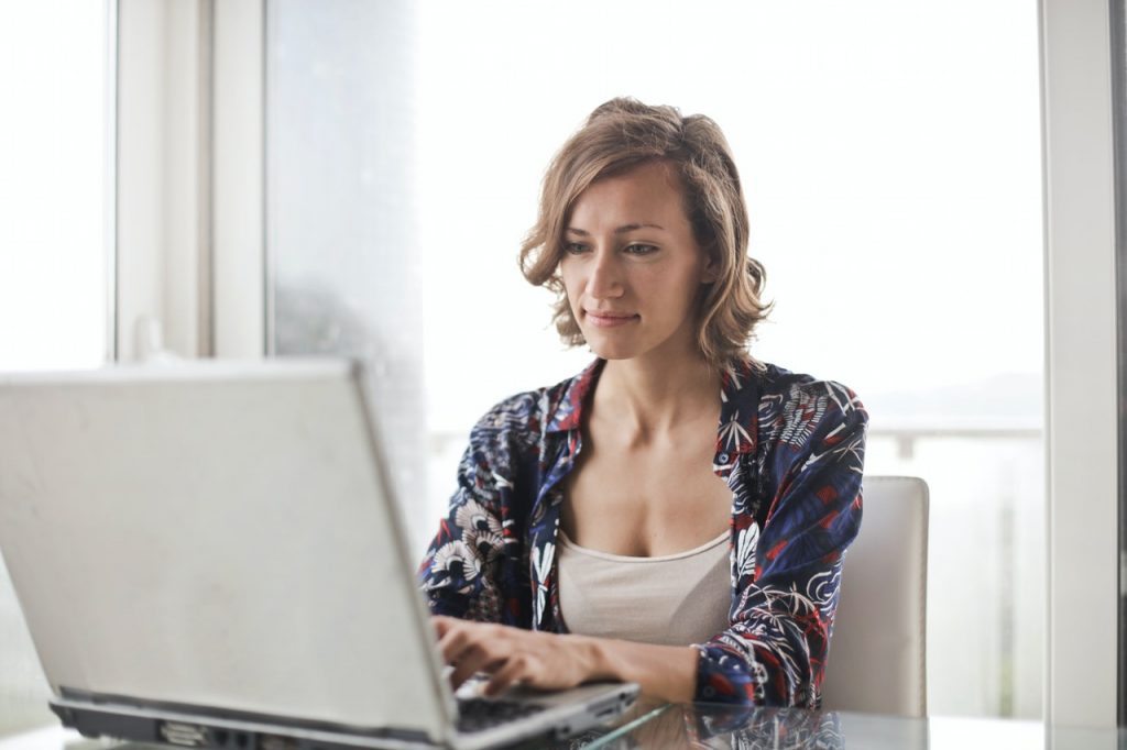 woman on computer comparing different Boise storage providers