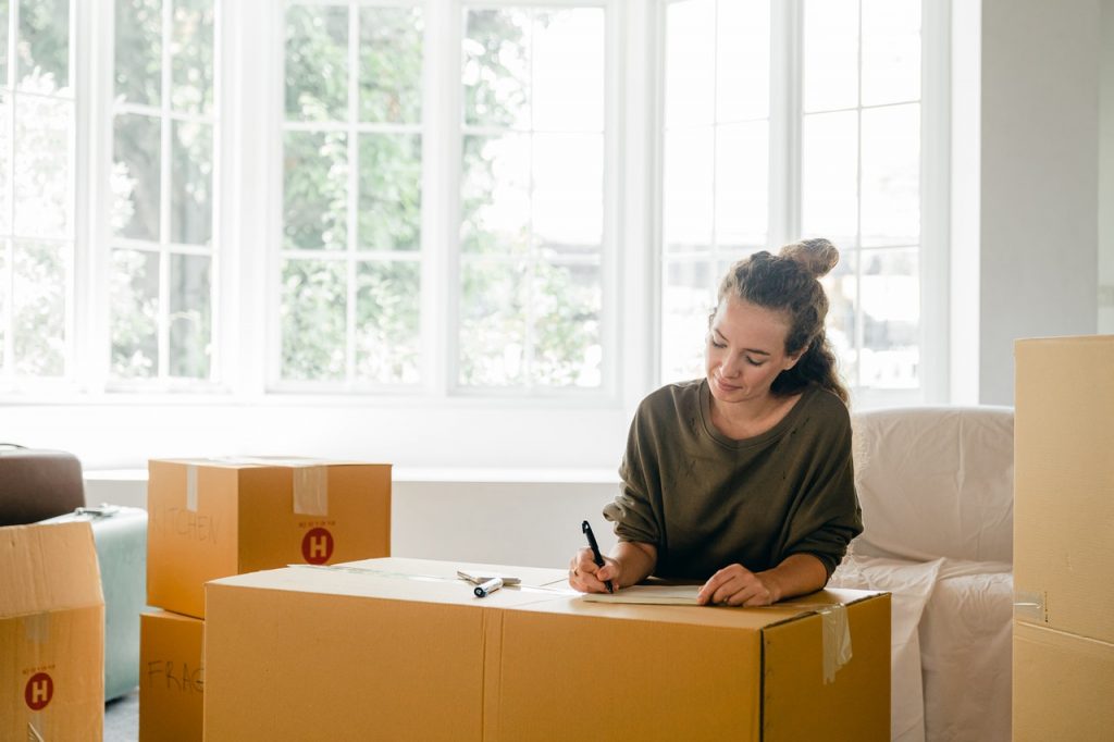 A girl packing for the move