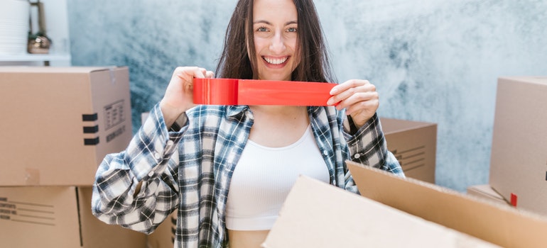 woman packing for moving out for the first time
