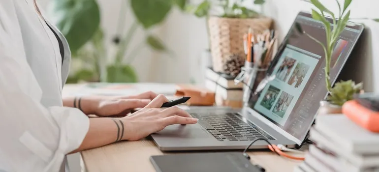 person digitalizing photos before storing your books and photos