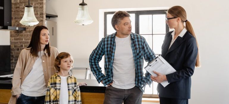 family talking with agent about relocation