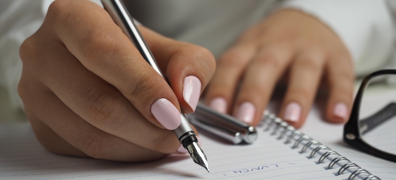 person following one of the essential tips for long-term storage and creating an inventory list