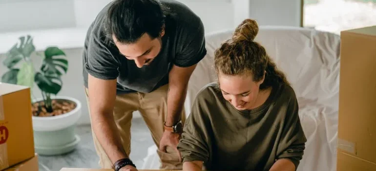 couple preparing for a move by checking all the benefits of hiring a local moving business