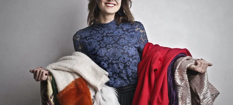 woman ready for storing off-season clothes