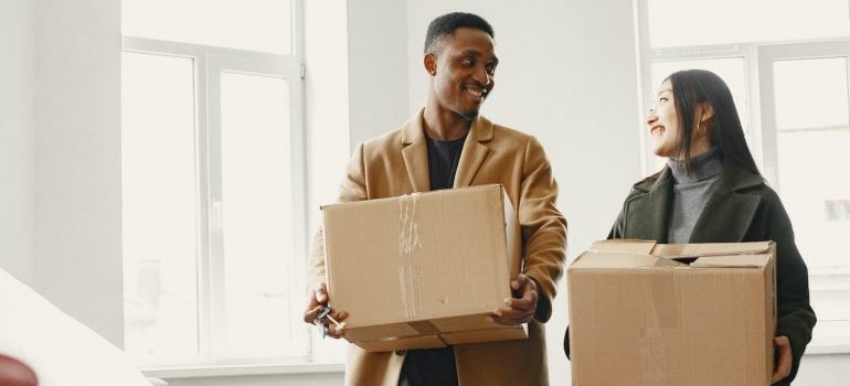 couple holding boxes