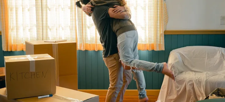 A man is hugging a woman during the relocation.