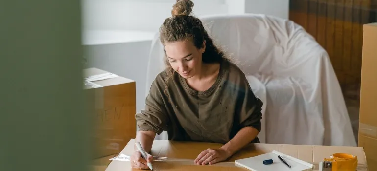 woman thinking of the risks of moving without preparation and setting up a schedule
