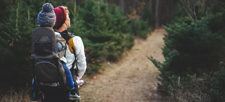 happy woman hiking with her child