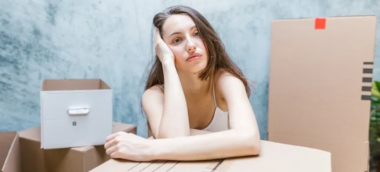 woman tired after packing for the move