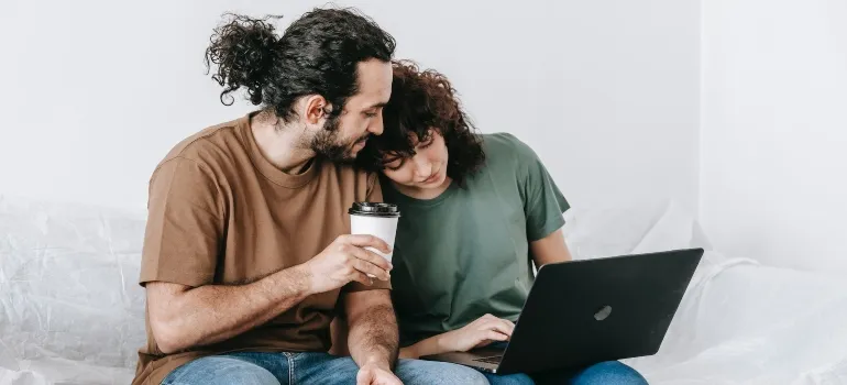 two people reading about living in Boise ID online