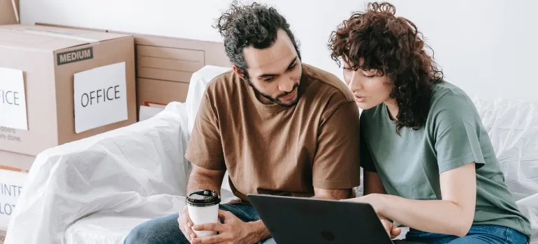 focused couple researching for most affordable cities in Idaho 