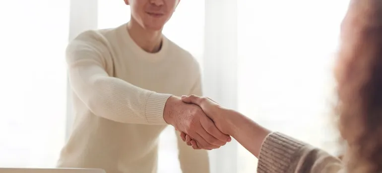 two people talking about expanding their business in most affordable cities in Idaho 