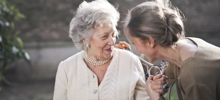 mother and daughter talking about Senior's guide on moving on a budget