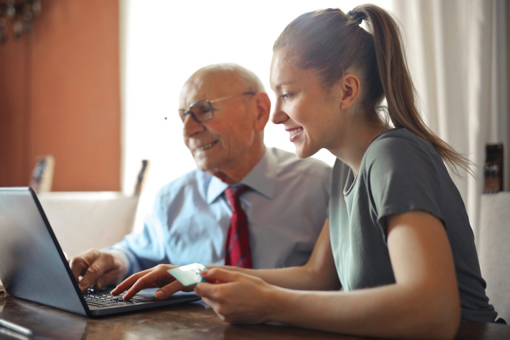 senior looking at the lap op for seniors guide on moving on a budget