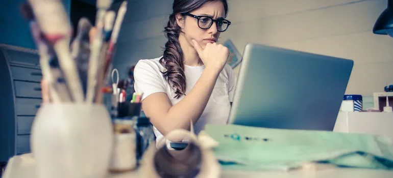 women thinking about benefits of hiring professional movers