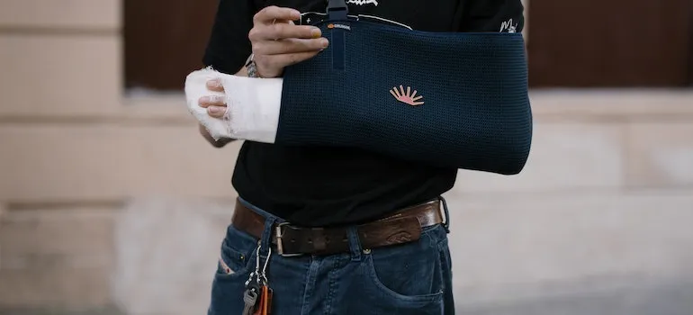 man with injured arm