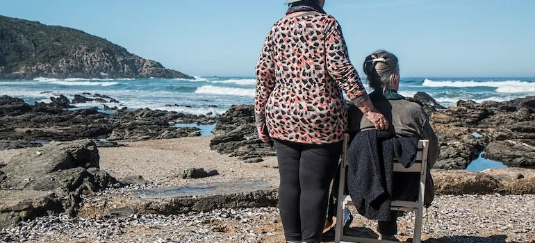 two women looking at the sea