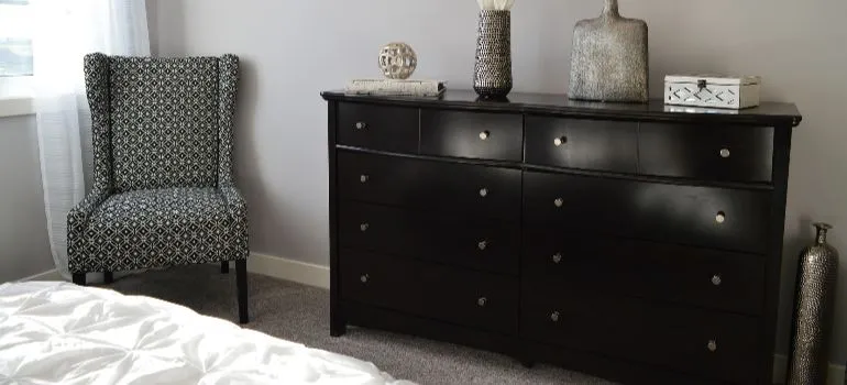 brown furniture dresser in a bedroom