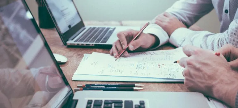 two people researching how to expand your manufacturing business in Idaho